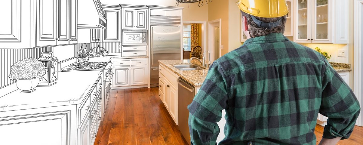 contractor looking at custom kitchen drawing