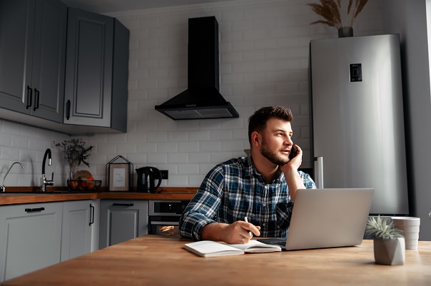 man working from home in kitchen